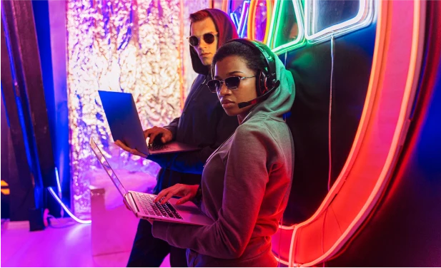 Marketers analyzing data on their laptop